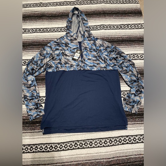 Brand new, never been worn with tags, Under Armour lightweight windbreaker. - Picture 1 of 2